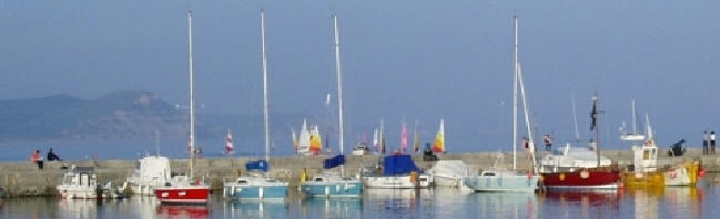 Lyme Regis harbour at sunset